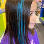 Girl with blue colored streaks